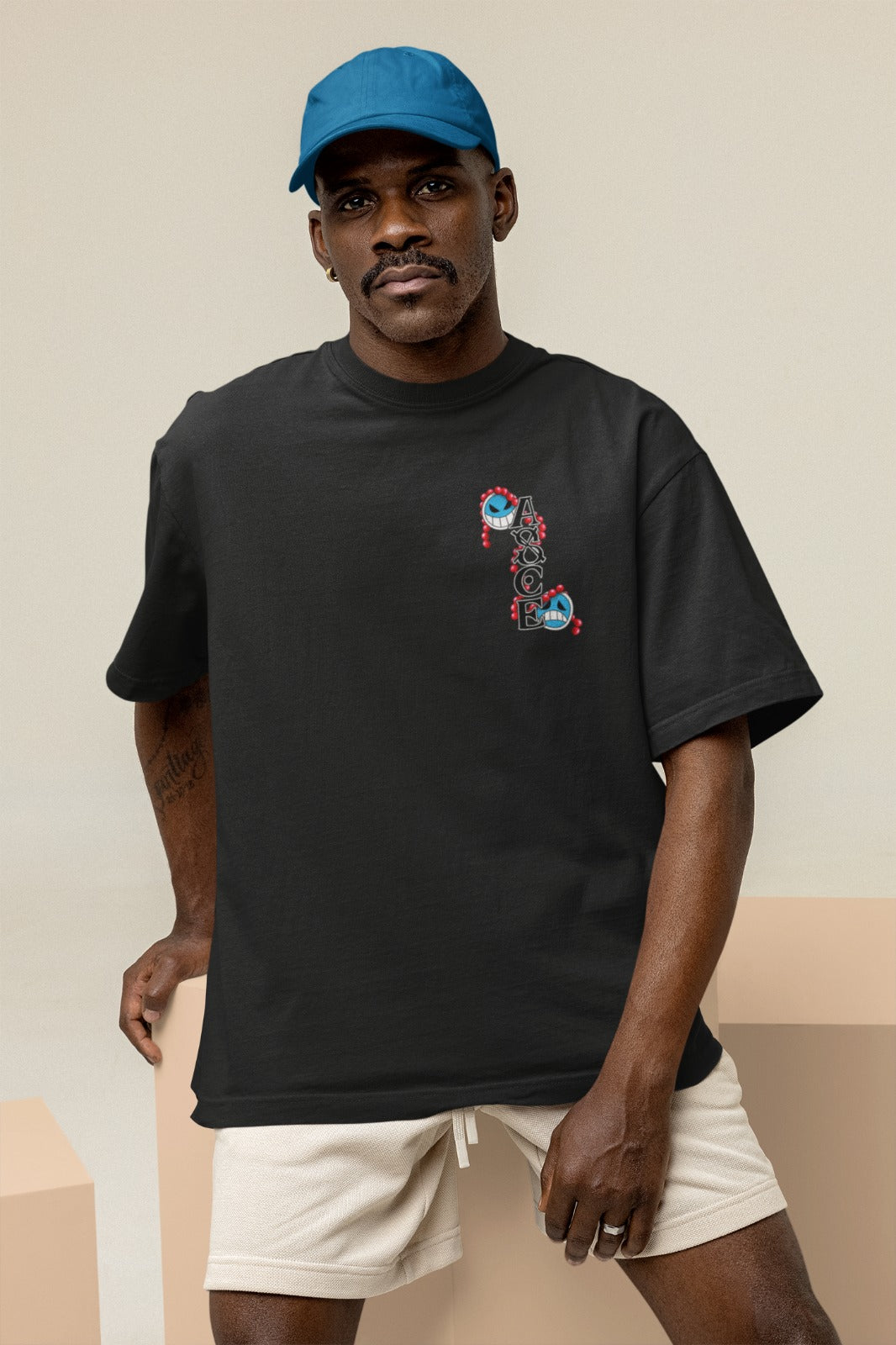Channel the power of Fire Fist Ace with our black unisex oversized t-shirt, featuring his iconic "ASCE" tattoo on the front. This captivating design pays tribute to Ace's legacy and adds authenticity to your style. Crafted for comfort and style, this trendy tee is a must-have for One Piece fans. Elevate your wardrobe and showcase your admiration for Ace today!