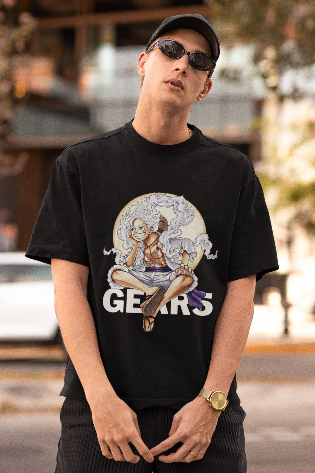 Unleash Luffy's strength with our black unisex oversized t-shirt featuring him in Gear 5 form, sitting on the bold "Gear 5" text. Crafted with premium materials, this trendy tee offers both comfort and style. Perfect for anime enthusiasts, it's a must-have addition to your collection. Express your love for One Piece with this unique and powerful design today!