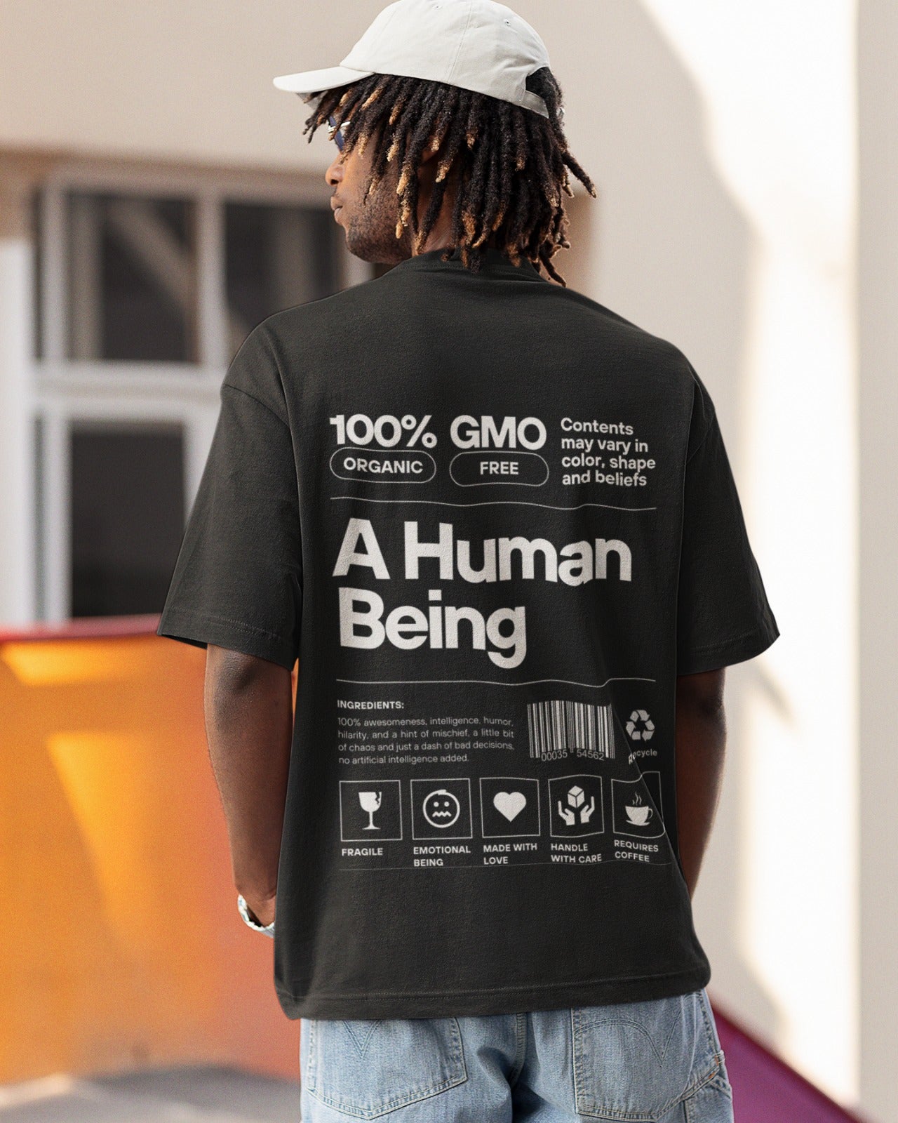 Elevate your style with our Premium Black Oversized T-Shirt - "A Human Being: Handle with Love and Coffee!" This unique tee features a back graphic designed like a product tag, celebrating our complexity. Stickers like "100% Organic," "GMO Free," "Fragile," and more, along with a list of ingredients, highlight the intricacies of human nature. Crafted with meticulous attention to detail. Order now and embrace your unique self with humor and authenticity.