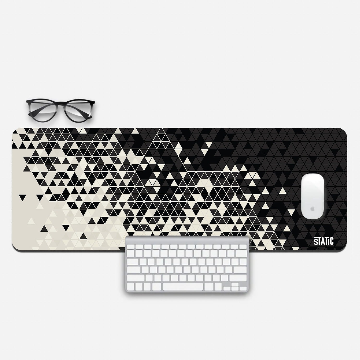 Transform your gaming station with our Extended Gaming Mouse Pad, featuring a captivating abstract design. With a pattern of black and white triangular tiles transitioning from dark to light, it adds a sleek and modern touch to your setup. Measuring 800x300mm, it offers ample space for precise mouse control. The skid-proof backing ensures stability during intense gameplay. Elevate your gaming experience with this stylish and functional mouse pad.