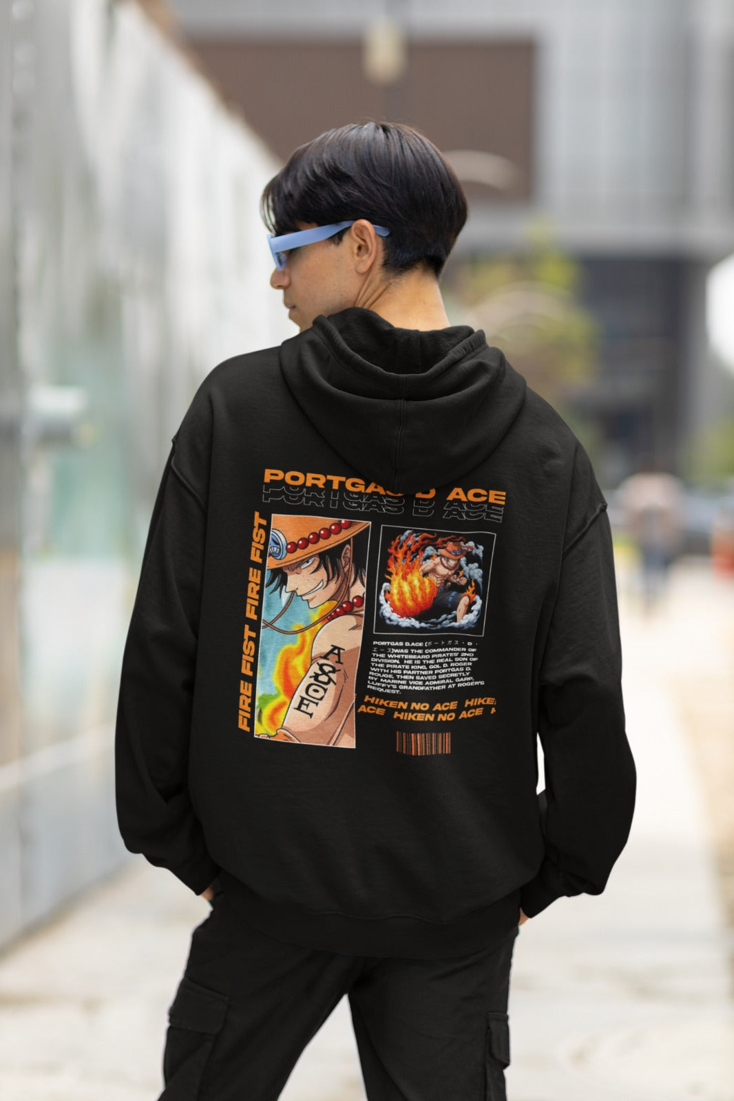 Introducing our Black Portgas D. Ace Oversized Hoodie, a must-have for all One Piece fans. The back design resembles an information card, highlighting Fire Fist Ace, Portgas D. Ace, and Hiken no Ace in bold orange letters, with key details about his powers and position. The front showcases Ace's iconic arm tattoo "ASCE" with the 'S' crossed out. Embrace the fiery spirit of Ace with this unique and comfortable hoodie, a perfect addition to your One Piece collection. Wear your passion for the series proudly.