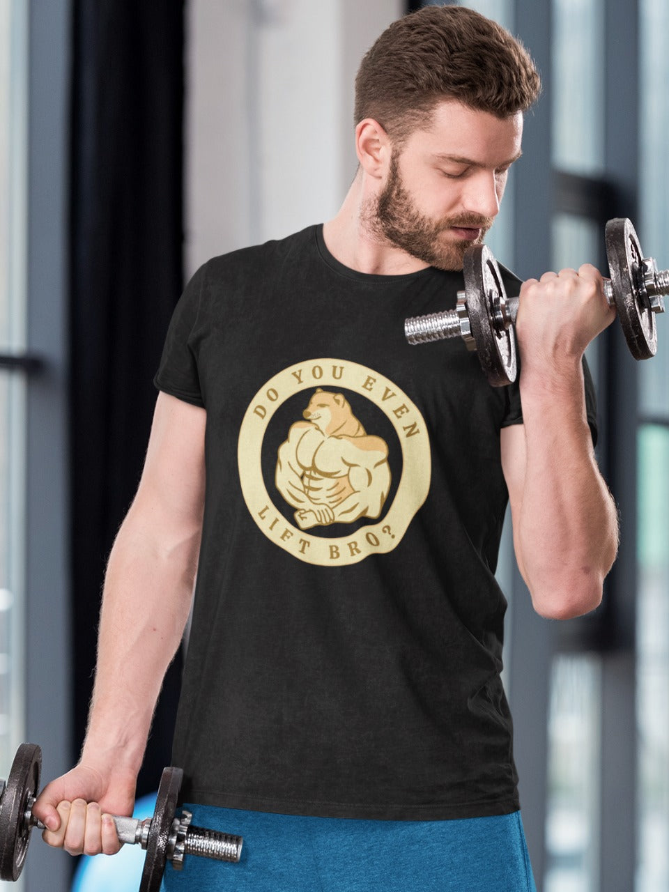 Man doing bicep curls in gym wearing a black tshirt with do you even lift bro printed on it in circle and buff doge flexing his muscles in the center of the circle, gymming funny memes with cheems shiba inu