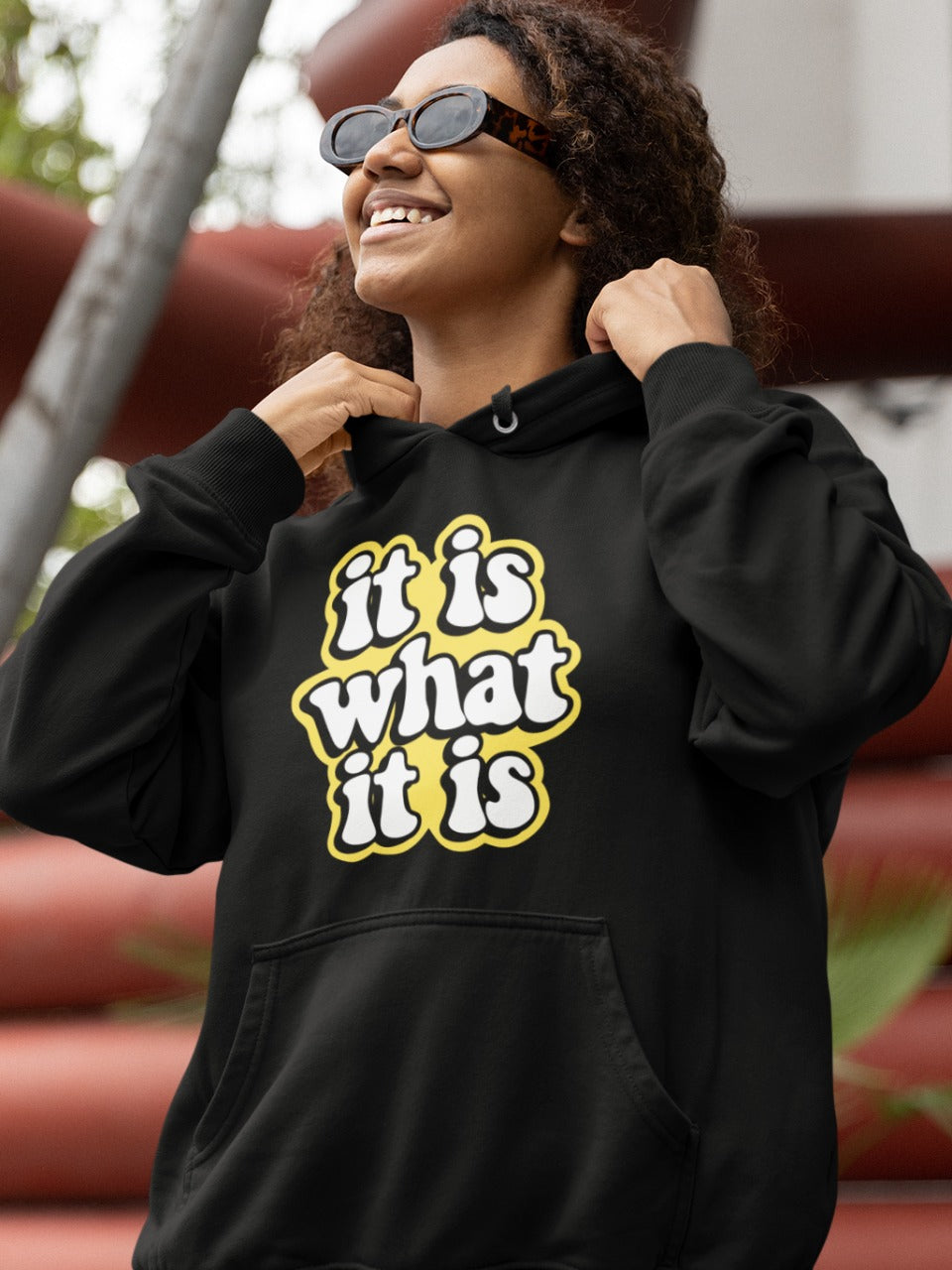 girl with black glasses wearing a black hoodie with it is what it is printed on it, fun sayings, relatable sarcastic memes