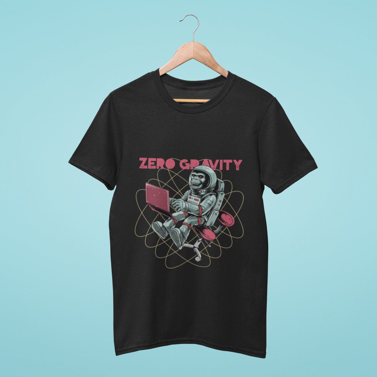 Elevate your wardrobe with our black t-shirt featuring a chimpanzee in a spacesuit working on a laptop in zero gravity. Perfect for science and tech enthusiasts who also love playful fashion. Made from high-quality materials, this comfortable and durable t-shirt is a must-have. Order now and add some intergalactic fun to your style!