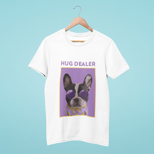 This white t-shirt features a French bulldog sporting trendy purple round sunglasses, with the title "hug dealer" written in bold letters. Spread positive vibes and embrace your inner hug dealer with this fun and playful tee. Perfect for dog lovers and those who love spreading love and kindness.