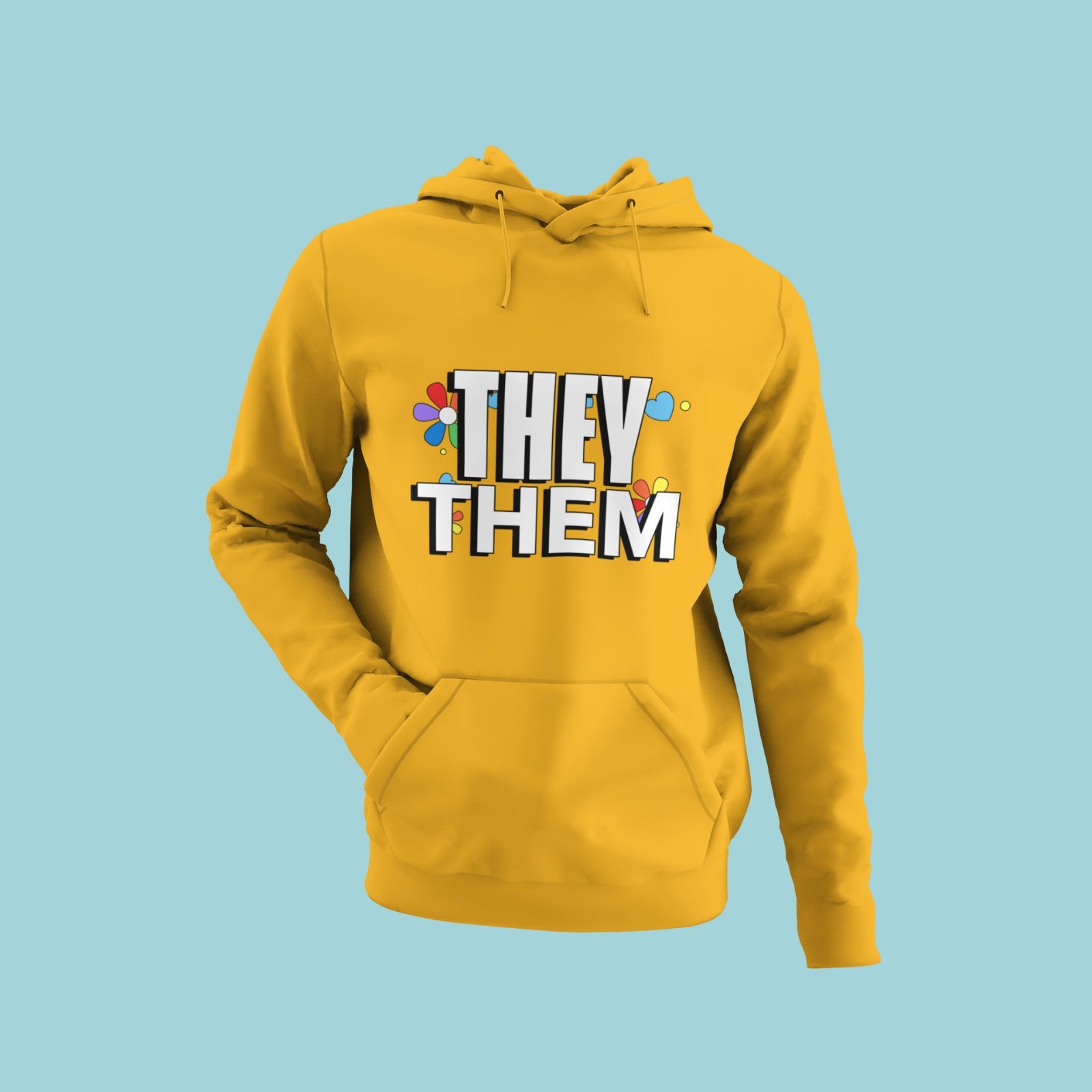 This yellow hoodie boldly declares "they them" in white letters, making a statement for gender inclusivity. The soft fabric and relaxed fit offer comfort while expressing pride in one's identity. Perfect for layering and available in a vibrant yellow, this hoodie is a standout addition to any wardrobe.