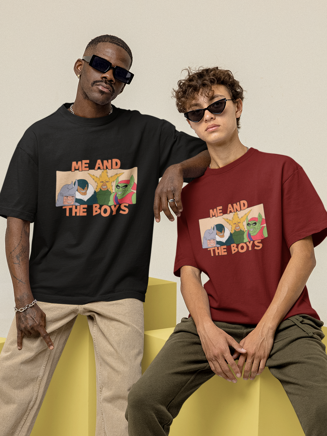 black guy making swagger sign with right hand and wearing black shades and black over-sized tshirt with me and the boys Spiderman villains meme printed on it and his left elbow is on his white friend's shoulder wearing black shades and maroon over sized t-shirt me and the boys Spiderman meme printed on it, fam relatable memes