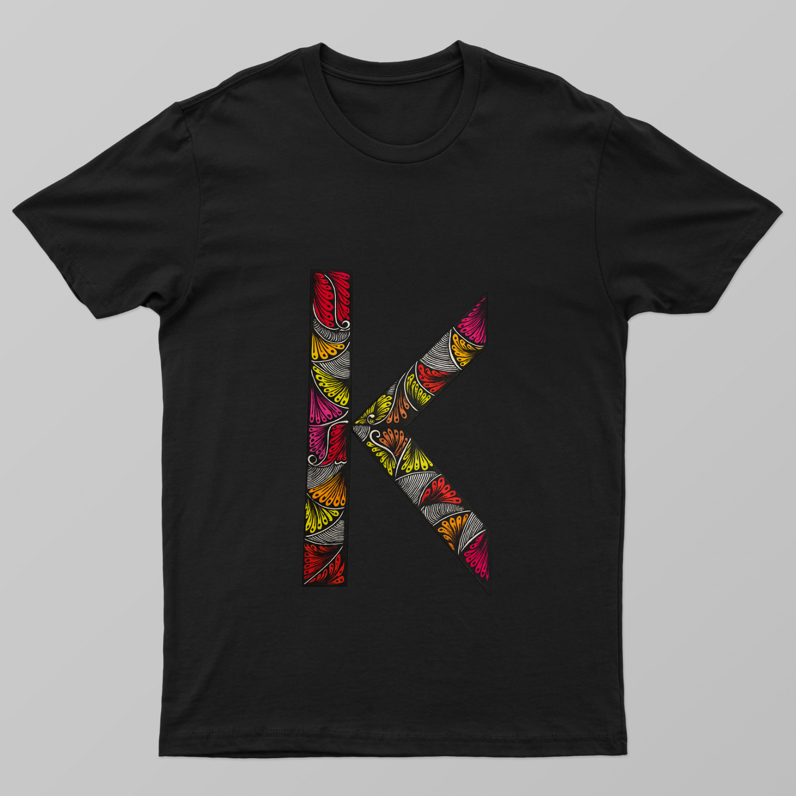 Alphabet mandala design Unisex T-shirt by Monika Goswami