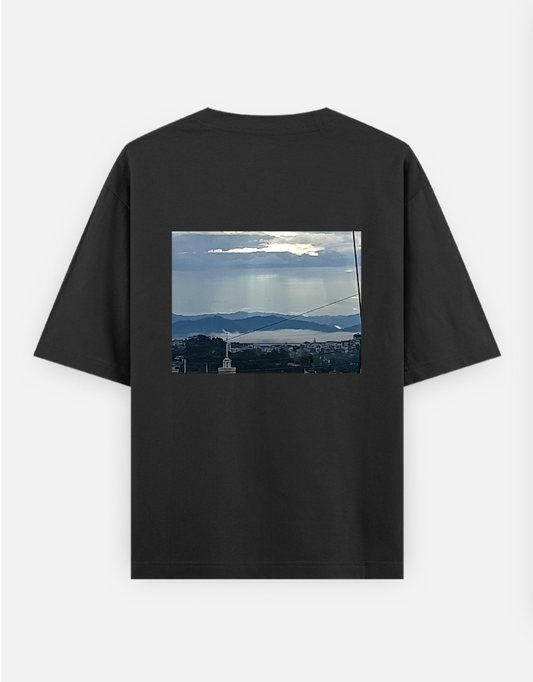 Sunlight through clouds in foggy weather Oversized T-shirt (Back print) by Rina
