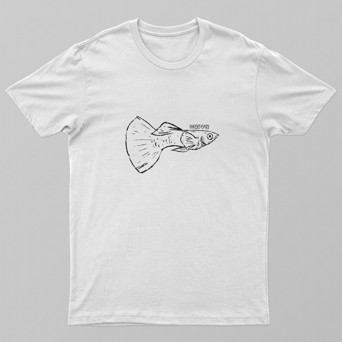 guppy is not a small fish Unisex T-shirt by Prithviraj B