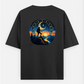A silhouette of a hiker stands on a mountain peak against a celestial backdrop featuring a zodiac wheel, a crescent moo Oversized T-shirt (Back print) by @ktart31