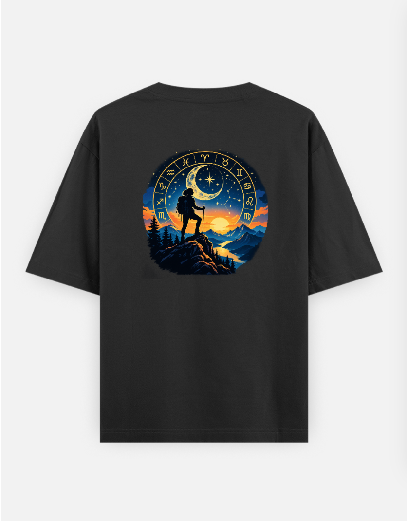 A silhouette of a hiker stands on a mountain peak against a celestial backdrop featuring a zodiac wheel, a crescent moo Oversized T-shirt (Back print) by @ktart31
