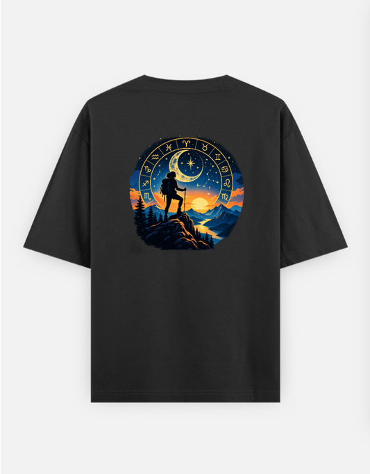 A silhouette of a hiker stands on a mountain peak against a celestial backdrop featuring a zodiac wheel, a crescent moo Oversized T-shirt (Back print) by @ktart31