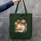 Bookish Cat Napping on Stack of Books Zippered Canvas Tote Zipper Tote Bag by SeJaa_Studio