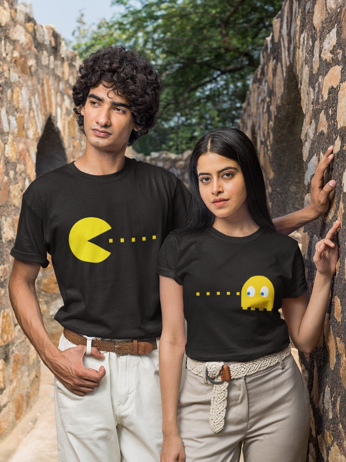 Get playful with your significant other with our black couple t-shirt set! One shirt features Pacman eating the trail, while the other has the ghost at the end of the trail. Made from high-quality materials, these t-shirts are comfortable and durable. Order now and show off your love in a fun way!