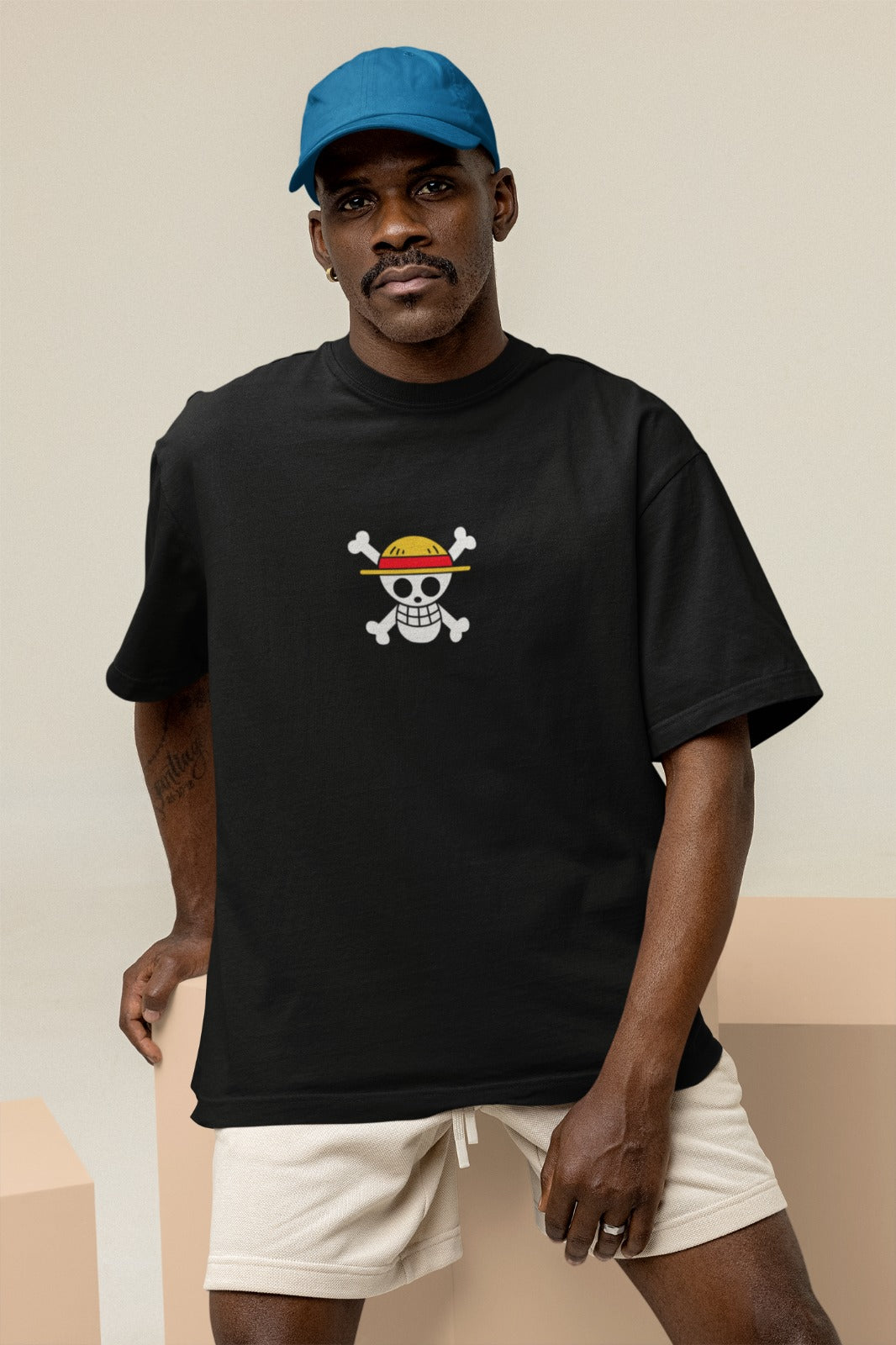 Level up your anime fashion with our black oversized t-shirt. Featuring One Piece's Straw Hat Pirate Crew Jolly Roger design, it showcases a realistic skull Jolly Roger on the back and a cartoonish version on the front. Made with high-quality materials, this trendy tee is perfect for casual outings or anime events. Join the Straw Hat Pirates and rock this stylish t-shirt today!