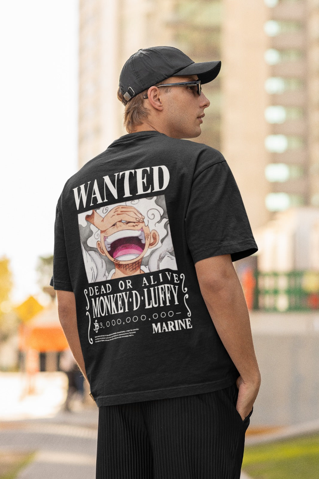 Step into the world of One Piece fashion with our black unisex oversized t-shirt featuring Luffy's latest wanted poster in Gear 5 form. Displaying a jaw-dropping bounty of 3 billion berries on the back, this captivating tee is a must-have for anime enthusiasts. Crafted for comfort and style, it's perfect for anime conventions or casual outings. Embrace the adventure and grab yours now!