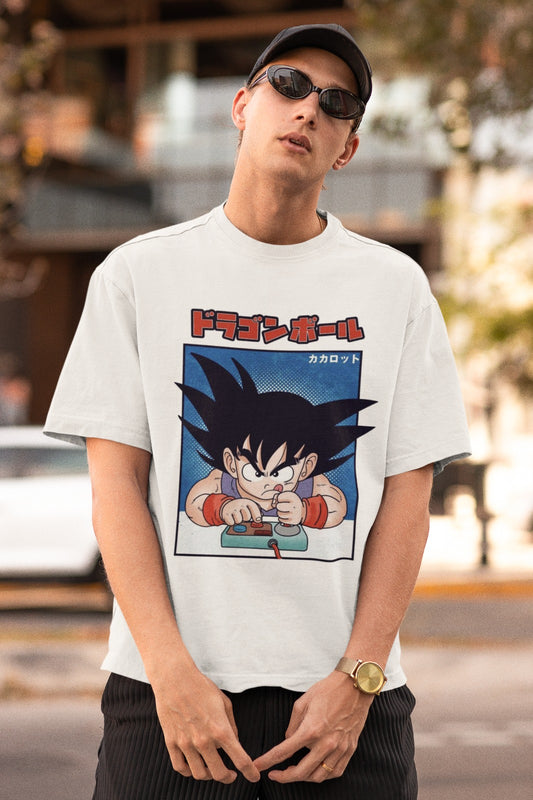 Embrace nostalgia with our white unisex oversized t-shirt featuring Kid Goku playing with a retro video game controller. "Dragon Ball" and "Kakarot" are beautifully written in Japanese characters, adding authenticity. Crafted for style and comfort, this trendy tee is a must-have for Dragon Ball and gaming fans. Express your passion with this unique and playful design today!