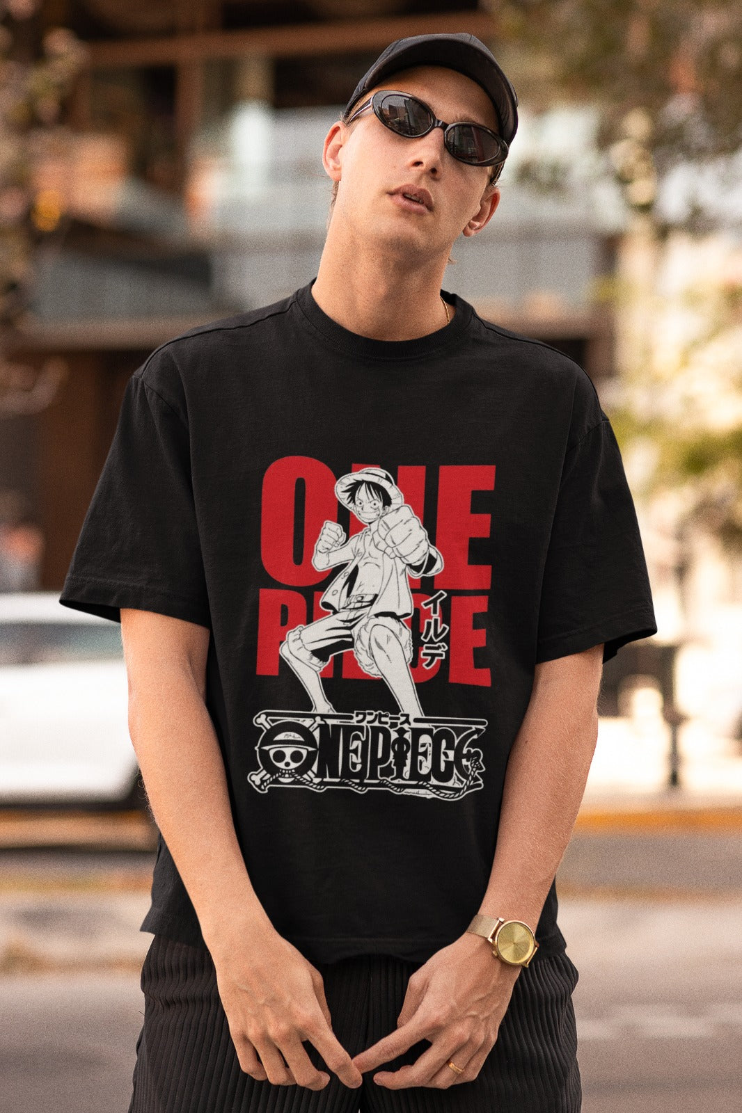 Embrace the spirit of adventure with our black unisex oversized t-shirt featuring bold "One Piece" written in red, as Luffy strikes a fierce fighting pose. Crafted for comfort and style, this dynamic tee is a must-have for One Piece fans. Channel your inner pirate and join Luffy's epic journey in this unique t-shirt. Set sail for greatness now!