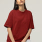  In this image, a young girl radiates casual elegance as she dons our Premium Heavyweight Maroon Oversized Tee. Its rich maroon hue contrasts beautifully with her grey shorts, creating a striking yet comfortable ensemble. The oversized tee drapes gracefully, embodying both comfort and style, while her relaxed confidence captures the essence of effortless chic.
