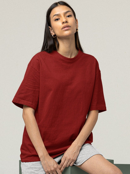  In this image, a young girl radiates casual elegance as she dons our Premium Heavyweight Maroon Oversized Tee. Its rich maroon hue contrasts beautifully with her grey shorts, creating a striking yet comfortable ensemble. The oversized tee drapes gracefully, embodying both comfort and style, while her relaxed confidence captures the essence of effortless chic.