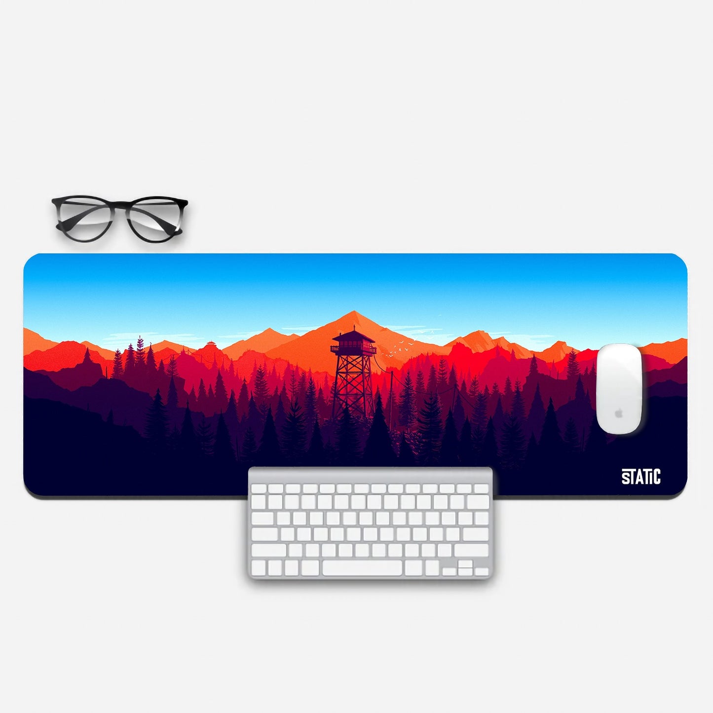 Enhance your gaming setup with our Extended Gaming Mousepad, showcasing a captivating digital landscape. Dive into the seamless transition from a serene dark forest to a fiery red mountain range under a pristine blue sky, all centered around a watchtower. With a size of 800x300mm, it offers ample room for precision and stability thanks to its skid-proof design. Elevate your gaming experience today!