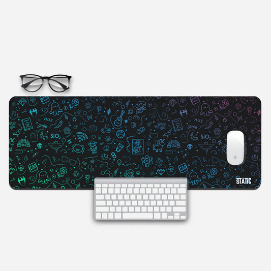 Elevate your gaming station with our Extended Gaming Mouse Pad, a captivating fusion of art and functionality. Featuring a vibrant collage of cute octopi, LEGO logos, glasses, and the iconic Mona Lisa, all in dazzling neon colors against a sleek black backdrop. This mouse pad not only adds a touch of creativity to your setup but also enhances precision and control for an unmatched gaming experience. Dive into the world of neon artistry - grab yours today!