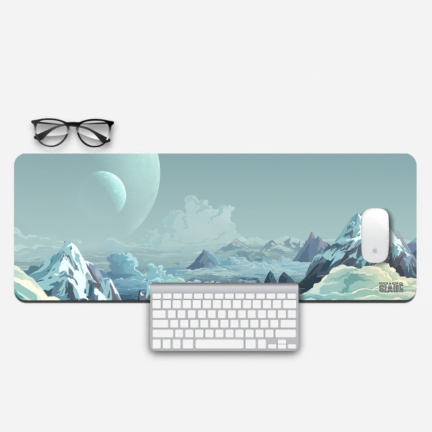 Elevate your gaming experience with our premium 800x300mm gaming pad. It's 3mm thick, providing a comfortable and supportive surface. Designed for gamers, it features skid-proof properties and a solid back grip for precise control. The stunning digital image of snow-clad mountains, taken from a summit, creates an immersive atmosphere. Printed with high-quality sublimation EPSON inks, this pad offers a fade-proof guarantee. Bring the mountains to your gaming setup – order now for a unique gaming adventure!