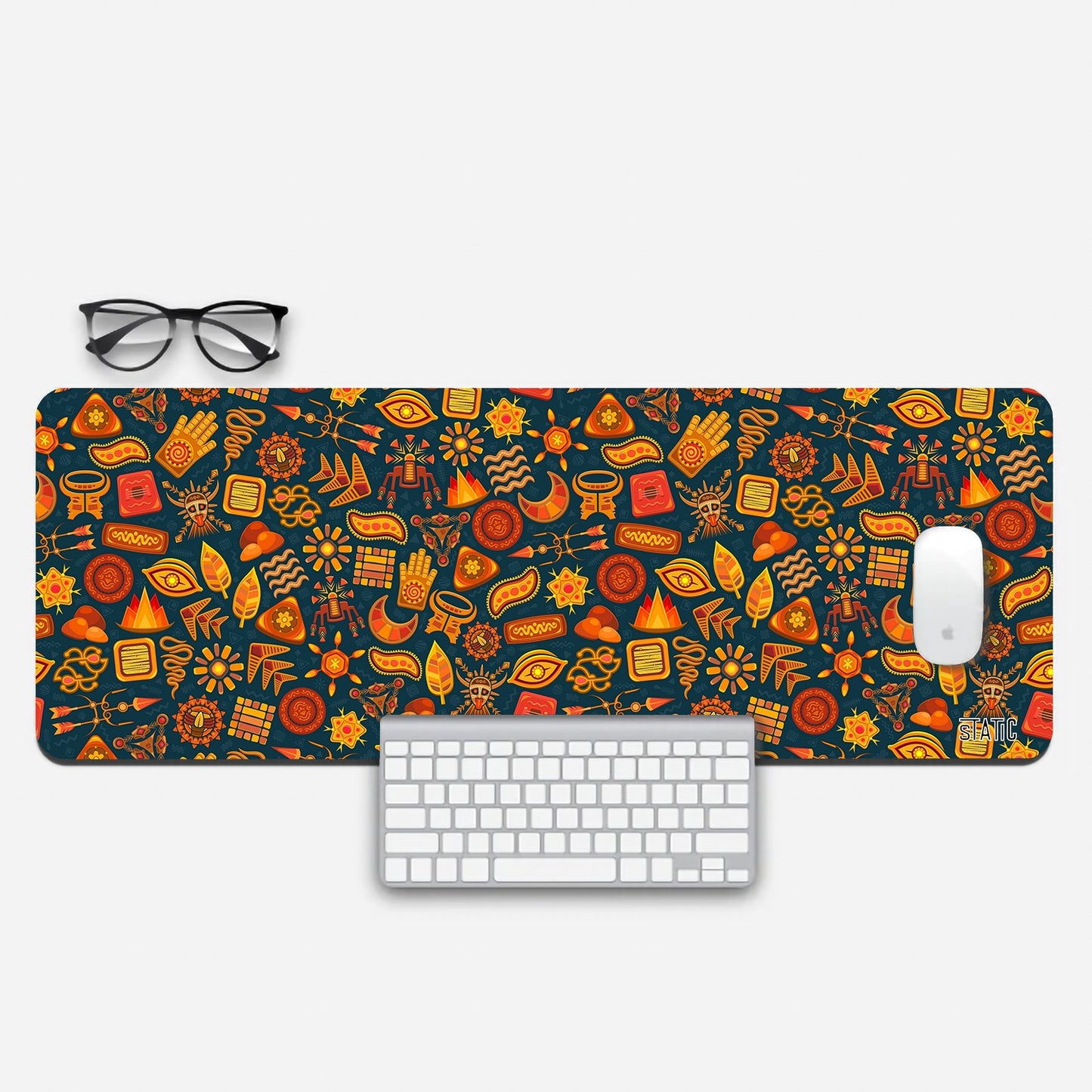 Elevate your gaming station with our Extended Gaming Mouse Pad, adorned with a mesmerizing collage of random red and golden doodles. Shapes, masks, leaves, and flowers come together in a unique and artistic design. Not only does it add flair to your setup, but it also provides a skid-proof surface for precision gaming. Bring both style and functionality to your gaming experience with this exceptional accessory. Play in style and let your creativity flourish.