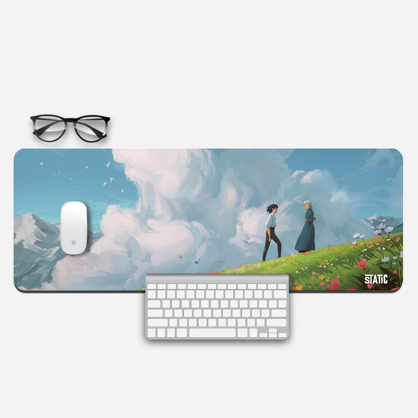 Step into the enchanting world of Howl's Moving Castle with our extended gaming mouse pad! Featuring Howl and Sophie against a backdrop of serene clouds and majestic mountains, this Studio Ghibli-inspired design elevates your gaming setup to a new level of artistry. Enjoy precise mouse control while basking in the romance and wonder of this beloved film. Level up your gaming experience today!