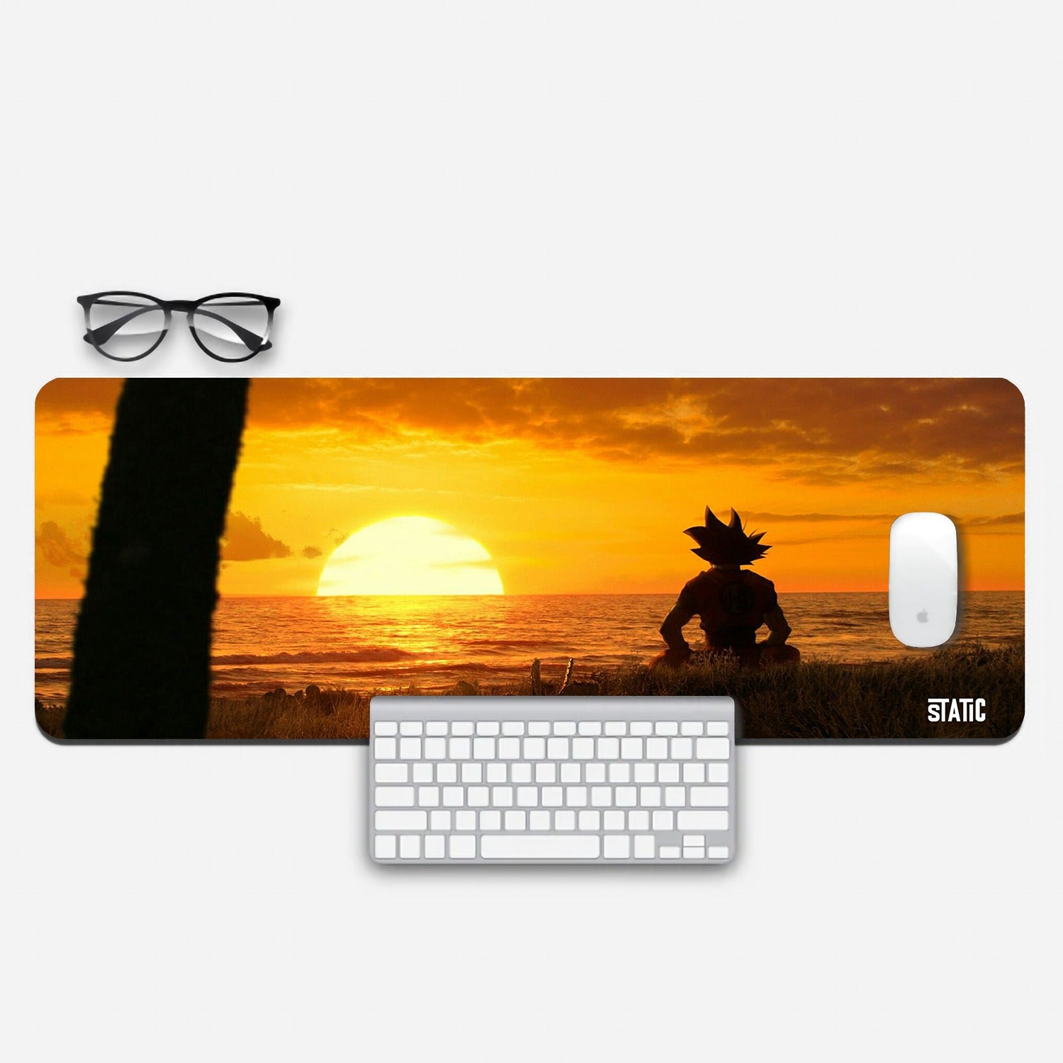 Get Inspired by Goku with Our Extended Gaming Mouse Pad! Immerse yourself in the Dragon Ball world as Goku sits serenely on a beach, silhouetted against a breathtaking sunset. The vivid colors and intricate details make every gaming session an adventure. Crafted for precision and durability, this mouse pad enhances your gaming performance. Elevate your gaming experience - order now!