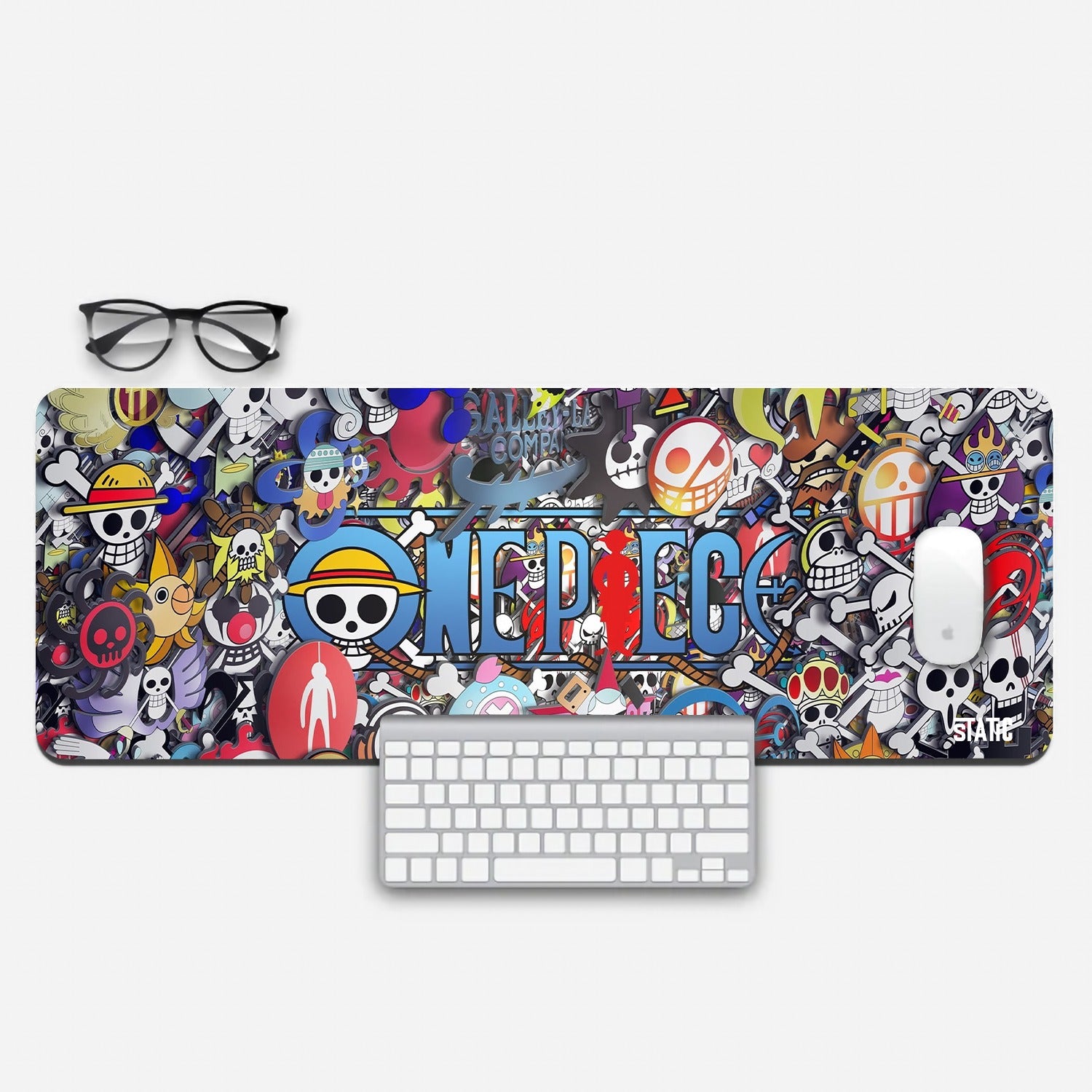 Dive into the thrilling world of One Piece with our Extended Gaming Mouse Pad. Featuring a captivating collage of all the iconic Jolly Rogers from the series encircling the legendary title, this mouse pad adds a touch of pirate adventure to your gaming setup. Crafted for precision and durability, it ensures smooth and responsive gameplay. Join the Straw Hat Pirates and embark on epic gaming quests. Order yours today!