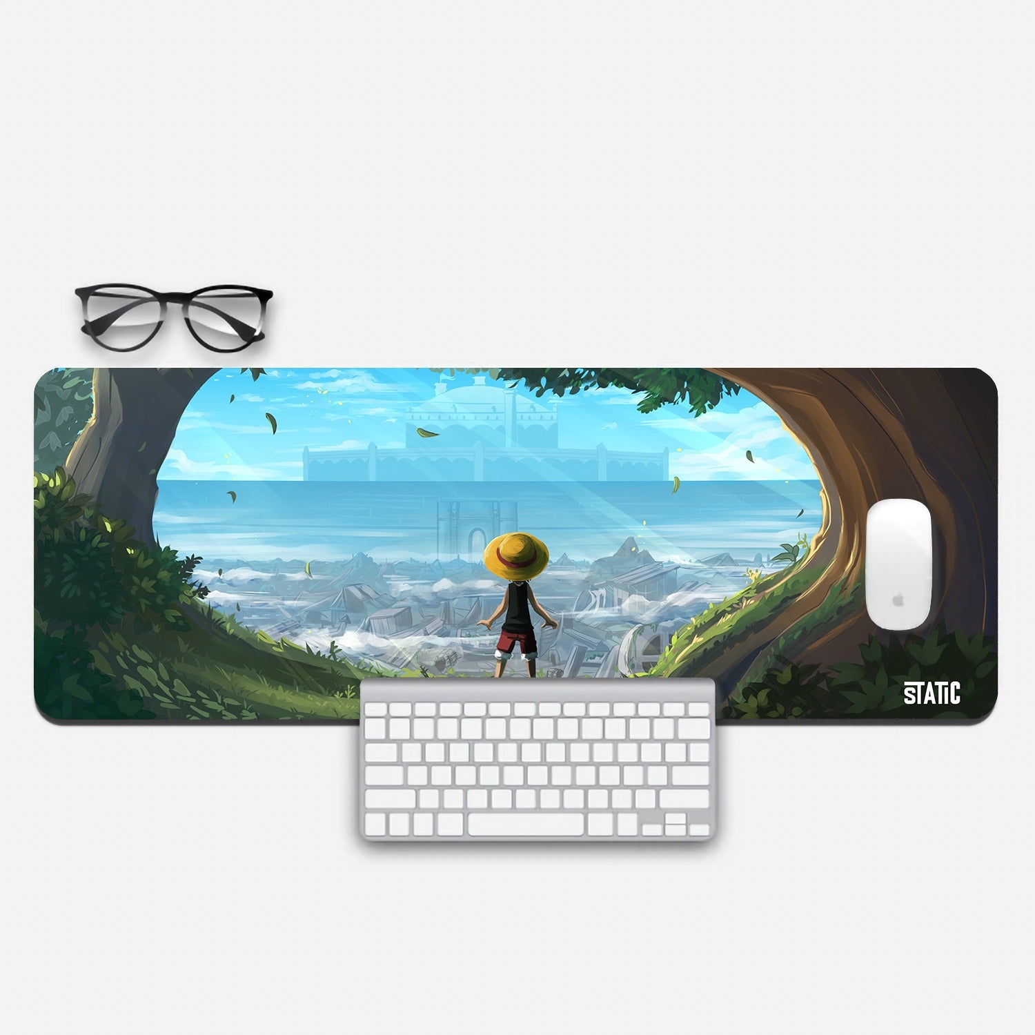 Explore the World of One Piece with Our Extended Gaming Mouse Pad  Dive into the epic world of One Piece with our extended gaming mouse pad featuring Kid Luffy. In this captivating design, Kid Luffy stands amidst towering trees in the forest, overlooking the wastelands beyond Goa Kingdom. The Goa Kingdom palace looms in the background, setting the stage for adventure. Immerse yourself in the grandeur of One Piece and elevate your gaming experience. Order now to embark on Luffy's legendary journey.