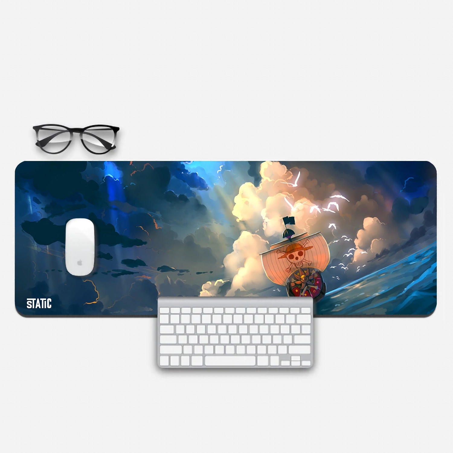 Sail the high seas of gaming with our extended mouse pad - Thousand Sunny Edition. Immerse yourself in the world of One Piece as the iconic Thousand Sunny ship sails under a dramatic, sunlit cloudy sky, surrounded by soaring seagulls. Elevate your gaming experience with this captivating design, offering precision and control. Order now and join the Straw Hat Pirates on epic adventures, conquering gaming challenges with the spirit of a true pirate!