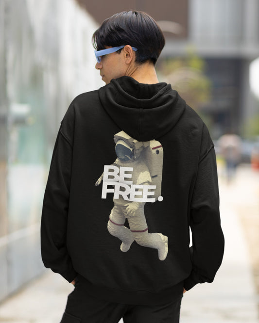 Step into the cosmos with our Black Oversized Hoodie. Its captivating back graphic portrays an astronaut drifting through space, accompanied by the empowering words "BE FREE." Crafted with precision and style in mind, this hoodie combines cosmic inspiration with contemporary fashion. It's perfect for making a statement while staying comfortable. Elevate your wardrobe and embrace the spirit of freedom. Order yours today and embark on a fashionable journey to the stars.