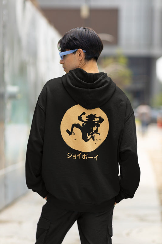 Embark on a legendary journey with our Black Oversized Hoodie, featuring Luffy in his awe-inspiring Gear 5 form, soaring over a golden moon. Beneath, "Joy Boy" is written in elegant Japanese characters, paying homage to One Piece lore. The front pocket area proudly displays the Straw Hat Pirates' iconic Jolly Roger. This hoodie seamlessly merges comfort and style for fans of grand adventures. Grab yours now and join Luffy in his quest for the ultimate treasure!