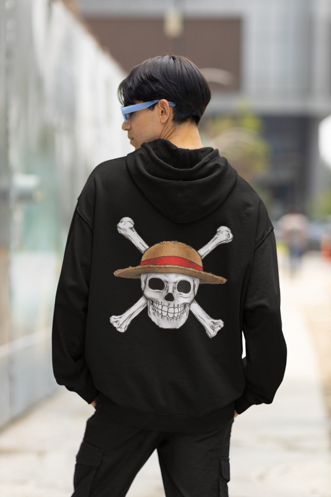 Elevate your style with our Black One Piece Oversized Hoodie. This hoodie showcases the iconic Jolly Roger of the Straw Hat crew, with a large, realistic skull on the back and a detailed anime-inspired logo on the front pocket area. Dive into the world of adventure and camaraderie with this beautifully designed and comfortable hoodie. A must-have for any One Piece fan, it's the perfect way to flaunt your love for this beloved anime. Upgrade your wardrobe and set sail with the Straw Hat Pirates today.