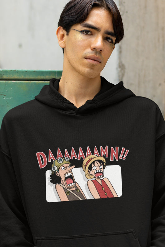 Elevate your style with our Black One Piece DAMN Oversized Hoodie. This eye-catching hoodie features a playful graphic design of Luffy and Usopp from the iconic One Piece series, leaning back in surprise with their mouths wide open, exclaiming 'DAAAAAAAMN!!' Whether you're a die-hard One Piece fan or simply love unique, fun designs, this hoodie is a perfect addition to your collection. Stay comfy and make a bold statement with this exciting piece of anime-inspired fashion.