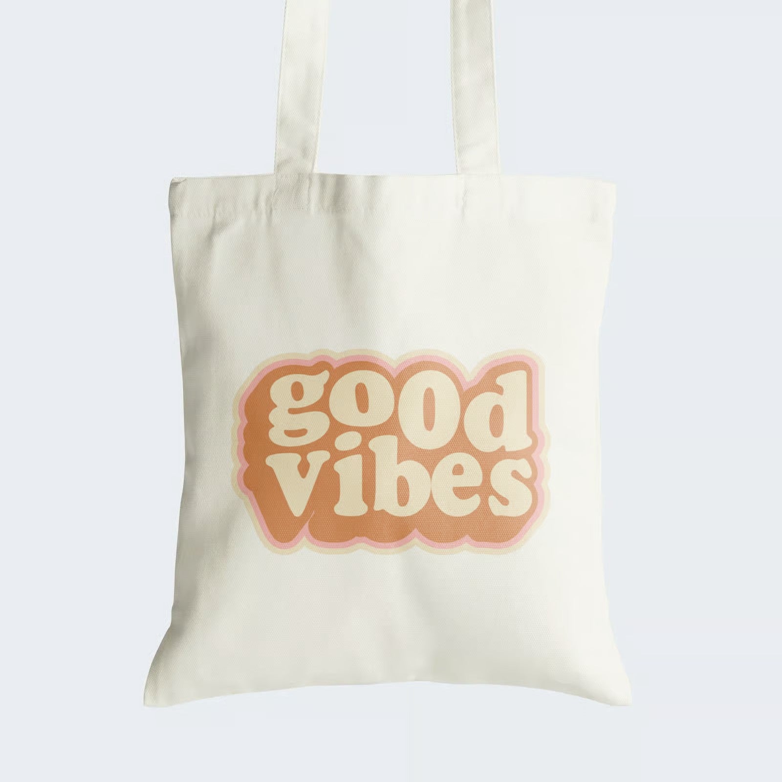 Elevate your style and radiate positivity with our "Good Vibes" Cotton Canvas Tote Bag. This vibrant tote showcases the words "Good Vibes" in cheerful orange and yellow lettering, spreading optimism wherever you go. Crafted for both durability and style, it includes a secure zipper closure for daily convenience. Carry this fashionable reminder to share positivity and embrace the good vibes in life. Order your Cotton Canvas Tote Bag today and let your style speak positively!