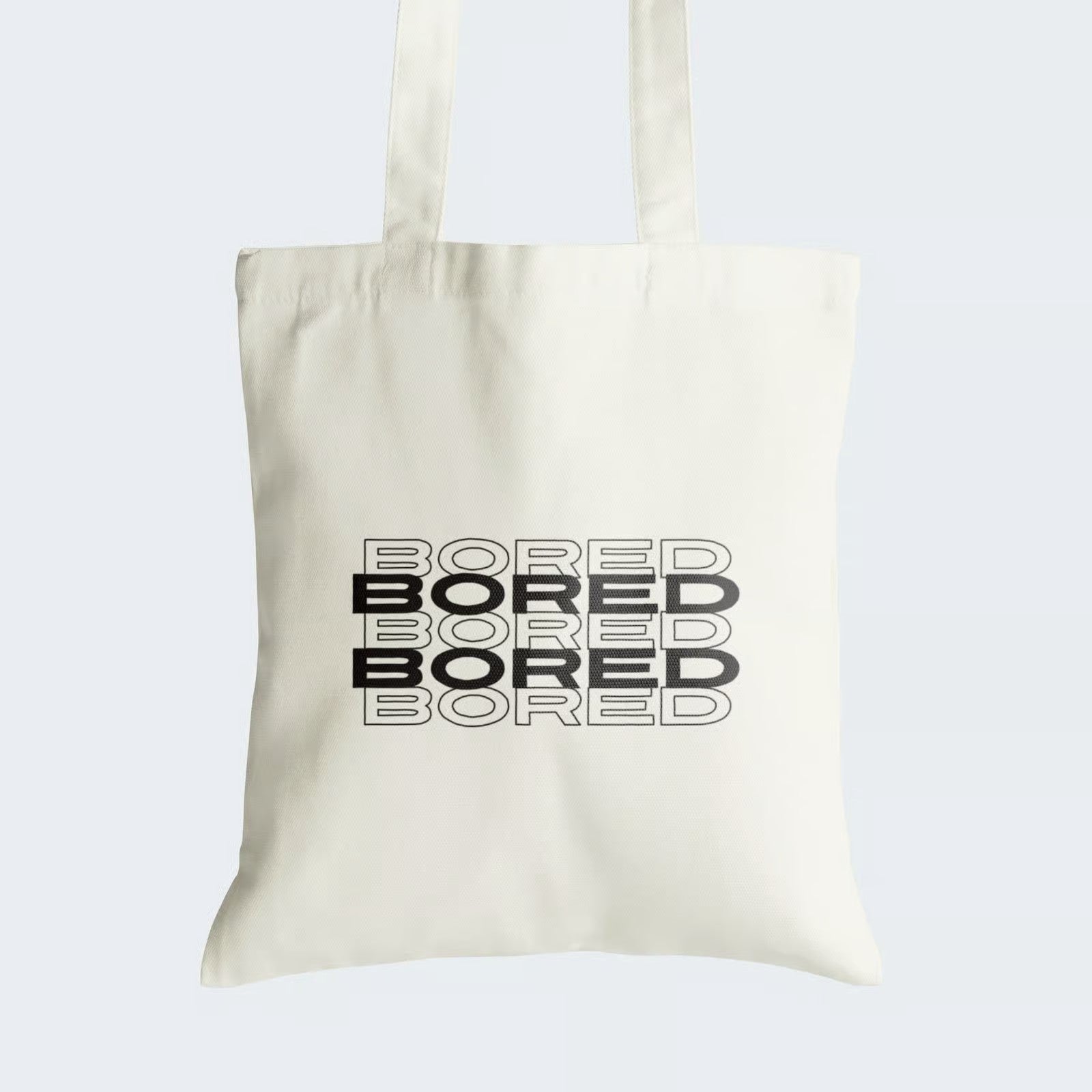 Elevate your style and make a bold statement with our "BORED" Cotton Canvas Tote Bag. This striking tote features the word "BORED" written five times, alternating between bold black and crisp white letters, creating a captivating visual impact. Crafted for durability and style, it includes a secure zipper closure for daily convenience. Express your mood with flair and individuality using our fashionable Cotton Canvas Tote Bag. Order yours today and let your style speak volumes!