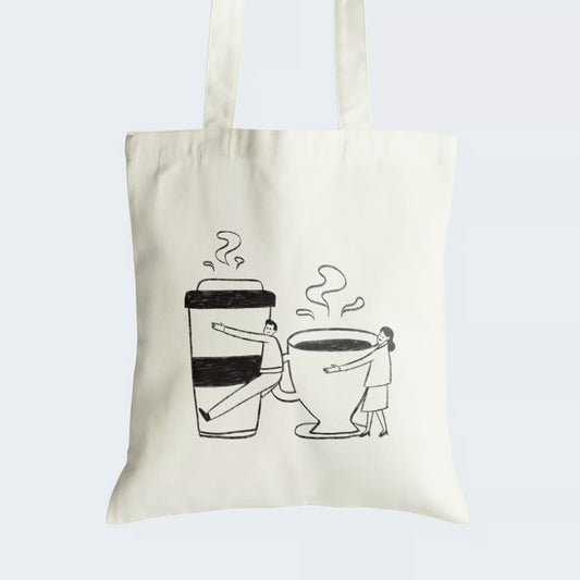 Elevate your style with our "Coffee Lovers' Embrace" Cotton Canvas Tote Bag. This charming tote features a heartwarming line art illustration of a man embracing a large coffee takeaway cup and a woman cuddling a traditional coffee cup, both filled with steaming hot brew. Crafted for style and durability, it includes a secure zipper closure for daily convenience. Order yours today!