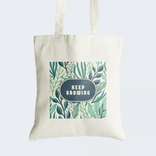 Elevate your style and inspire personal growth with our "KEEP GROWING" Cotton Canvas Tote Bag. This tote features an empowering caption set against a lush backdrop of vibrant greenery, symbolizing the essence of continuous development and vitality. Crafted for both durability and style, it includes a secure zipper closure for daily convenience. Carry a message of progress and motivation with our "KEEP GROWING" Cotton Canvas Tote Bag. Order yours today and nurture your personal growth in style!