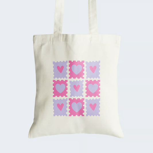 Elevate your style with our "Pink and Lavender Love" Cotton Canvas Tote Bag. It features a charming 3x3 matrix of hearts, alternating in soft pink and soothing lavender, creating an aesthetically pleasing design. Crafted for both durability and style, this tote bag includes a secure zipper closure for daily convenience. It's not just a bag; it's a canvas of love and aesthetics. Order yours today and carry romance and artistry wherever you go!