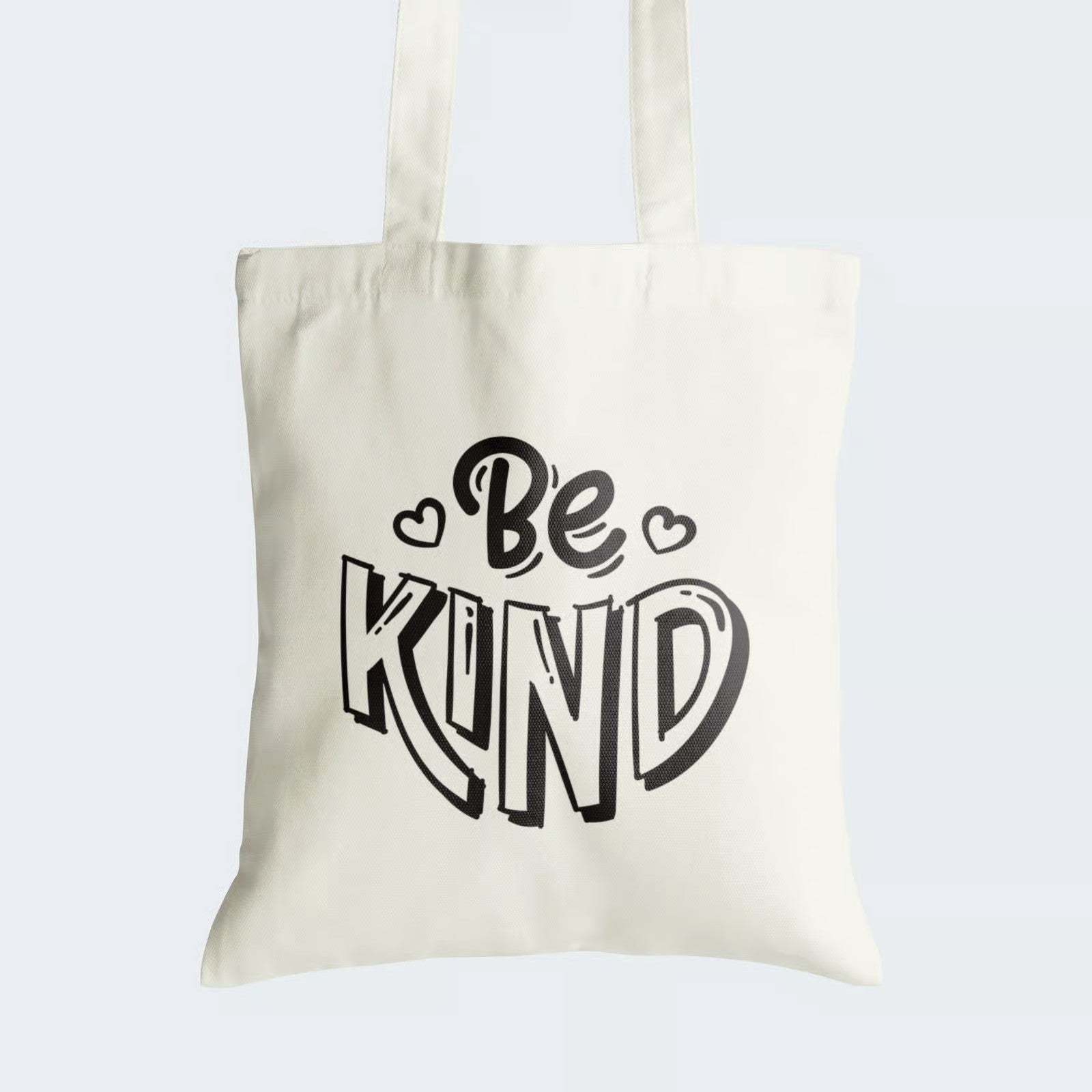 Elevate your style while promoting kindness with our "Be KIND" Cotton Canvas Tote Bag. This tote features bold black graphic text, reading "Be KIND," serving as a daily reminder to spread compassion and goodwill. Crafted for both durability and style, it includes a secure zipper closure for daily convenience. Make a statement and inspire positive change with our "Be KIND" Cotton Canvas Tote Bag. Order yours today and carry kindness with you wherever you go!