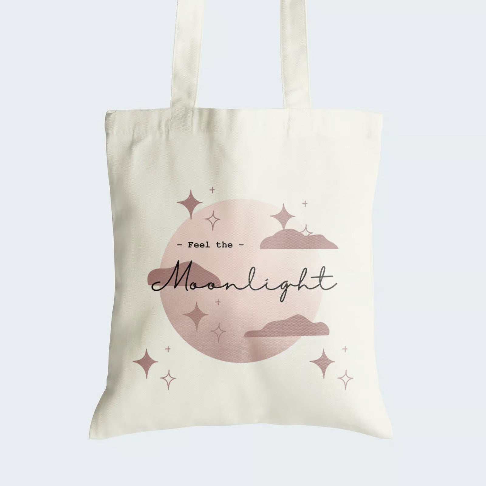 Elevate your style and embrace enchantment with our Cotton Canvas Tote Bag. Adorned with a captivating image of a full moon, glitter, and delicate clouds in a dark faded pink hue, accompanied by the empowering caption "Feel the Moonlight." Crafted for both durability and style, this tote features a secure zipper closure, making it ideal for daily use. Choose sustainability and carry a touch of celestial magic wherever you go!