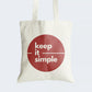 Elevate your style with our Cotton Canvas Tote Bag, featuring a maroon circle housing the timeless message "Keep it Simple." Crafted for both durability and elegance, this tote boasts a secure zipper closure for everyday convenience. By choosing this reusable bag, you embrace the beauty of simplicity while making a fashionable statement. Elevate your accessory collection with our "Keep it Simple" Cotton Canvas Tote Bag - order now to carry simplicity in style!