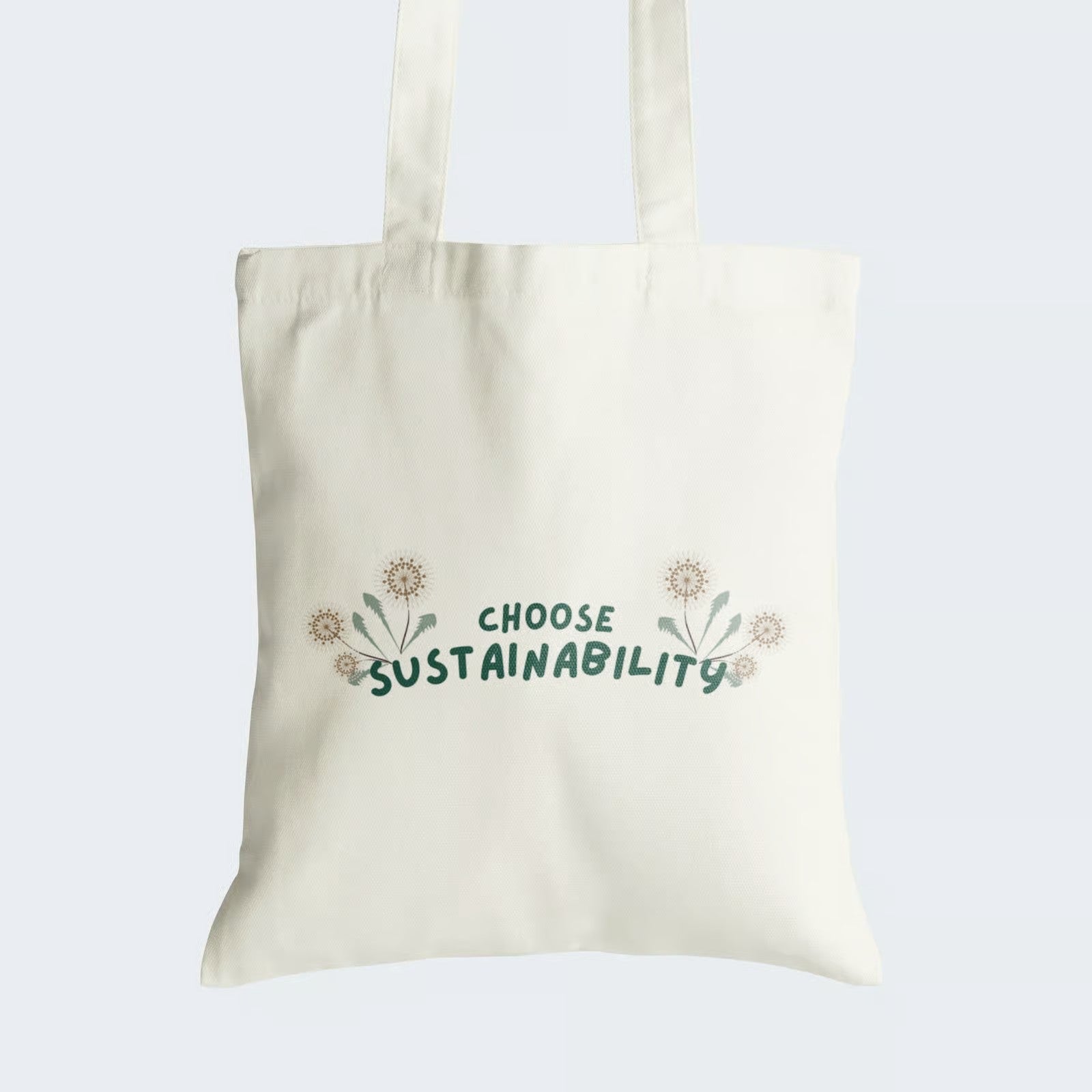 Elevate your style and commitment to sustainability with our Cotton Canvas Tote Bag. Featuring vibrant green graphic text "Choose Sustainability" adorned with dandelion flowers, this tote blends fashion and eco-consciousness seamlessly. Crafted for durability and style, it includes a secure zipper closure for daily convenience. Carry your values with our "Choose Sustainability" Cotton Canvas Tote Bag - order now!