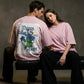 Two people wearing matching pink t-shirts with a floral design and text.