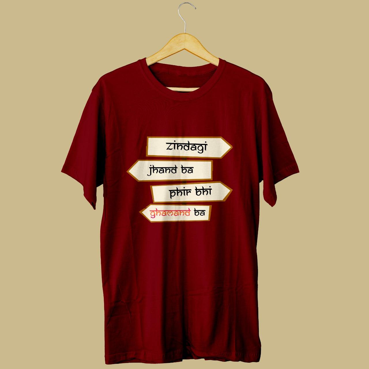 Looking for a stylish maroon t-shirt that reflects your attitude towards life? Check out our round neck t-shirt made from high-quality cotton, featuring the catchy tagline "Zindagi jhand ba phir bhi ghamand ba". Order now to experience the perfect blend of style, comfort, and attitude.