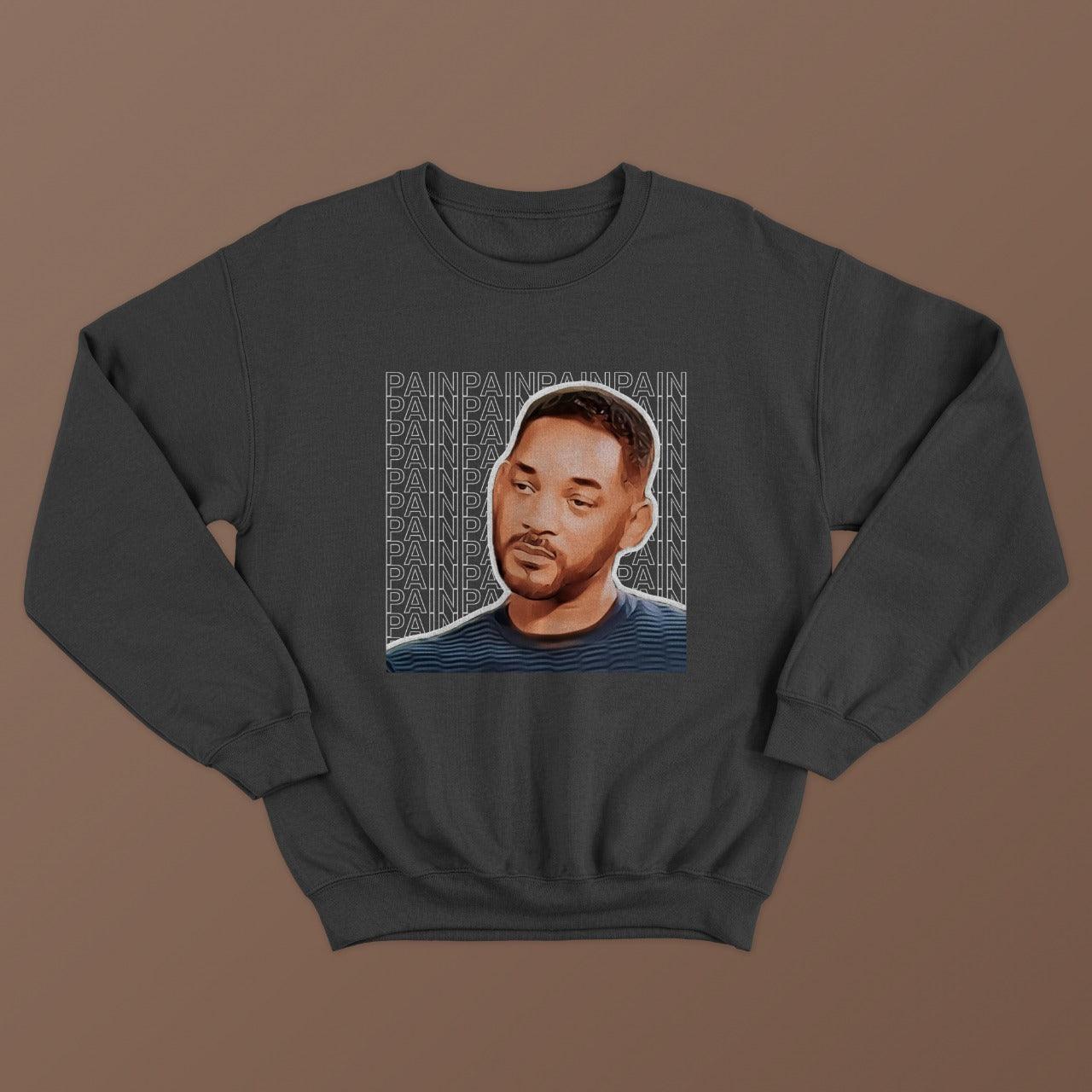 dark grey sweatshirt with picture of sad will smith printed on it with pain written multiple times in the background, relatable memes